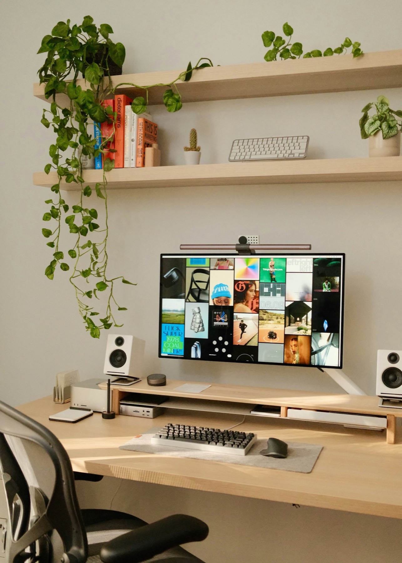 Creative studio desk with a monitor of design work